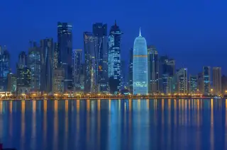 West Bay district of Doha seen from the corniche at night.jpg